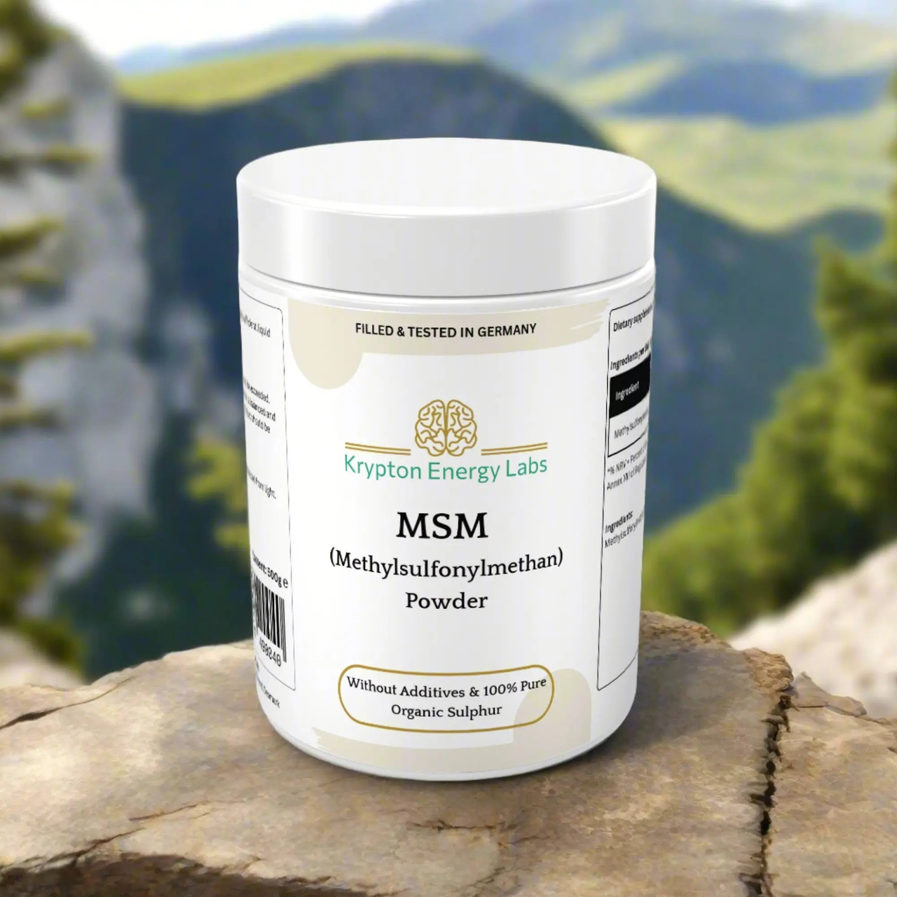 A white container of MSM Powder from Krypton Energy Labs is placed outdoors on a rock. The label highlights that it is filled and tested in Germany, contains organic sulfur, is without additives, and 100% pure. Known for promoting joint health, it’s set against a scenic mountain landscape backdrop.